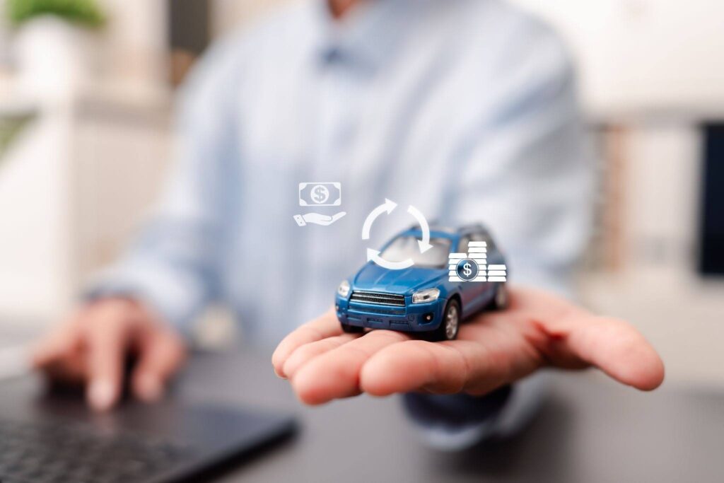 a photo of a toy car with three symbols illustrating money