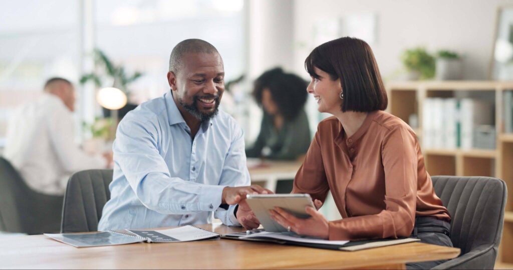 a man is meeting with a lender to discuss the details of a loan